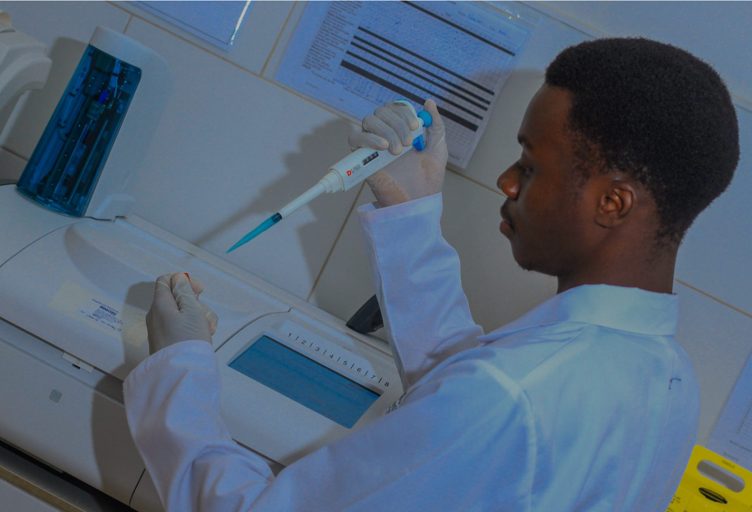Laboratory technologist pipetting a sample at Oak Diagnostic Center